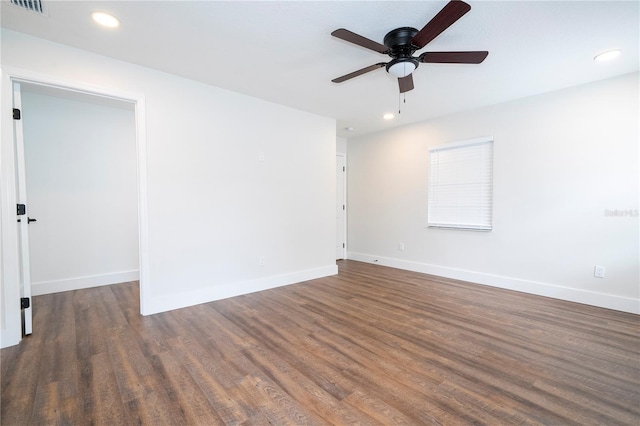spare room with a ceiling fan, wood finished floors, baseboards, and recessed lighting
