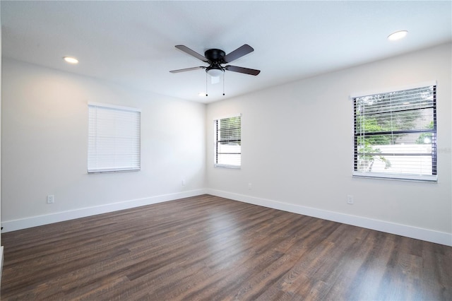 spare room with baseboards, dark wood-style floors, recessed lighting, and a ceiling fan