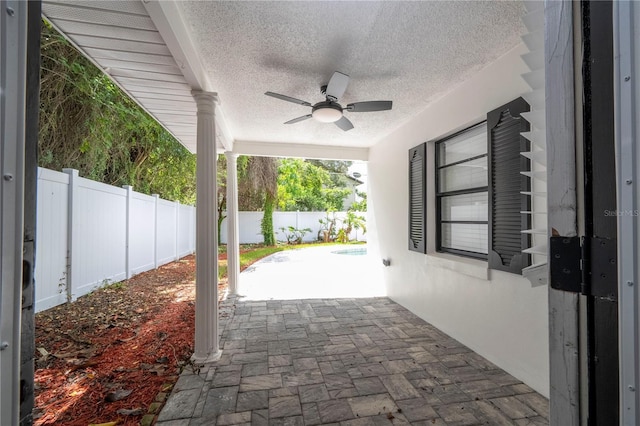 view of patio / terrace with a fenced backyard and a ceiling fan