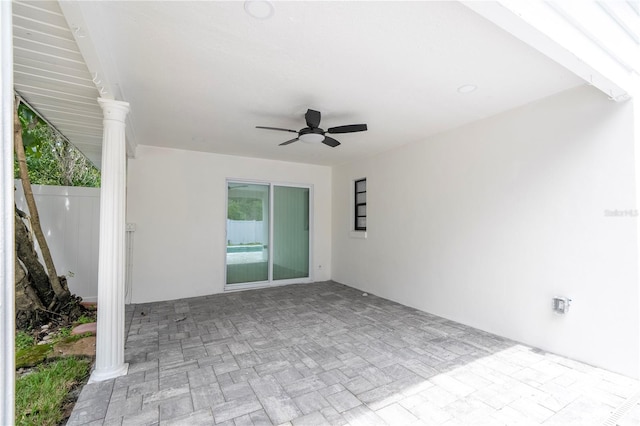 view of patio featuring fence and a ceiling fan