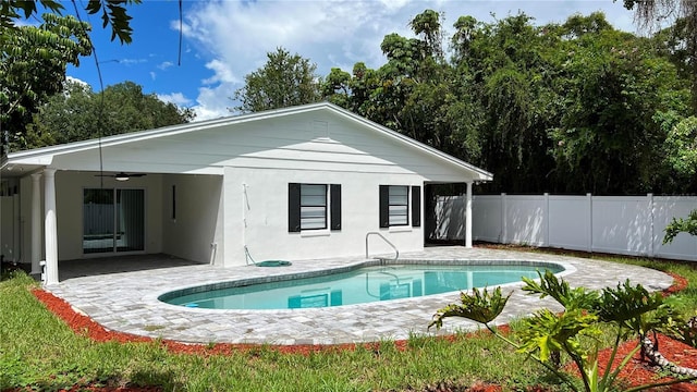 view of pool with a ceiling fan, a fenced in pool, fence, and a patio area