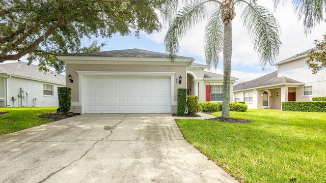 ranch-style house with a garage and a front yard