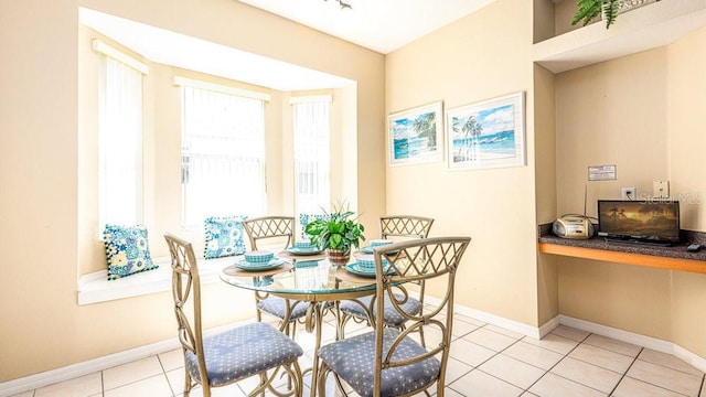 dining space with light tile patterned flooring