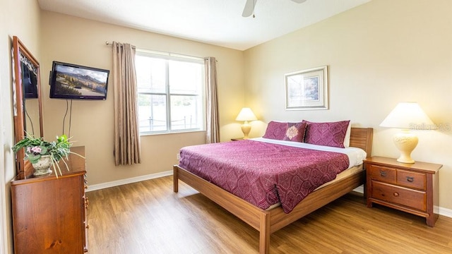 bedroom featuring hardwood / wood-style floors and ceiling fan