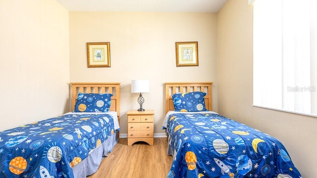 bedroom featuring light wood-type flooring