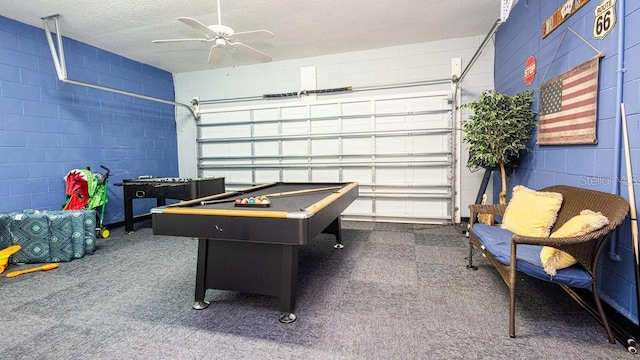 game room featuring a textured ceiling, billiards, ceiling fan, and carpet floors