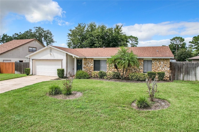 ranch-style house with a garage and a front lawn