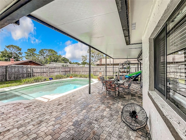 view of swimming pool with a patio area