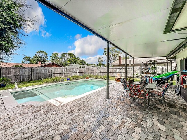 view of swimming pool featuring a patio area