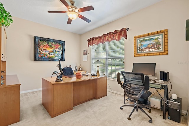 carpeted office space featuring ceiling fan