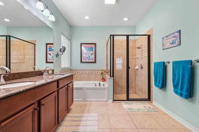 bathroom with tile patterned floors, separate shower and tub, and vanity