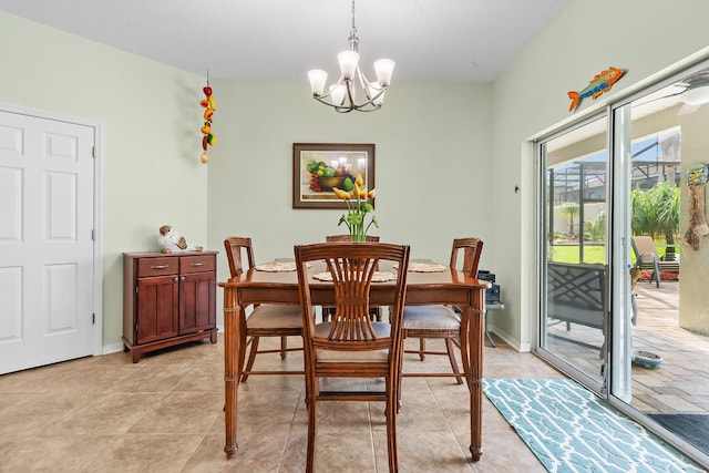 dining area featuring light tile patterned floors and a chandelier