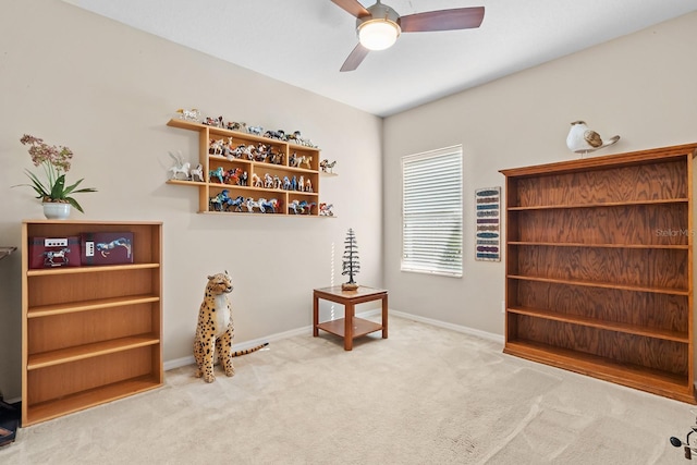 misc room featuring carpet and ceiling fan