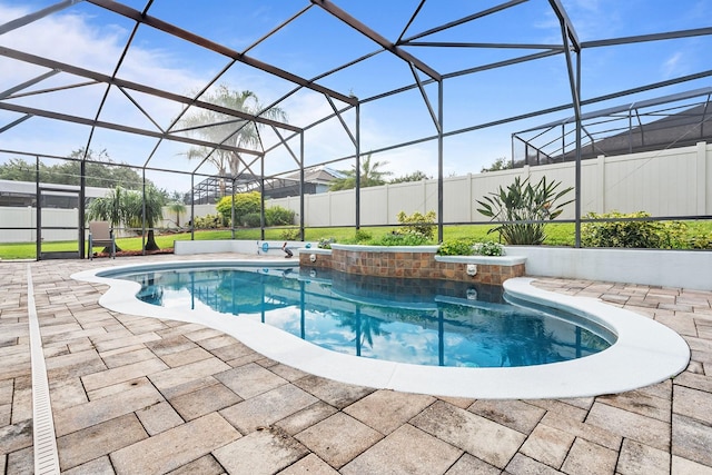 view of pool featuring a lanai and a patio