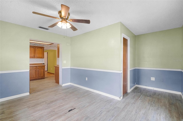 1005 Crescent Pkwy, Deland, FL 32724 - unfurnished room featuring light wood-type flooring, baseboards, ceiling fan, and visible vents