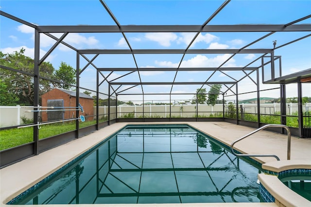 1005 Crescent Pkwy, Deland, FL 32724 - view of swimming pool featuring an outdoor structure, a patio, a fenced in pool, and a fenced backyard