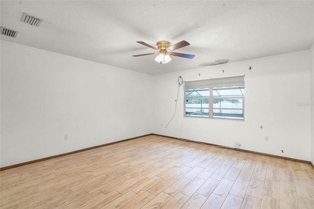 1005 Crescent Pkwy, Deland, FL 32724 - spare room with visible vents, a ceiling fan, light wood finished floors, and baseboards