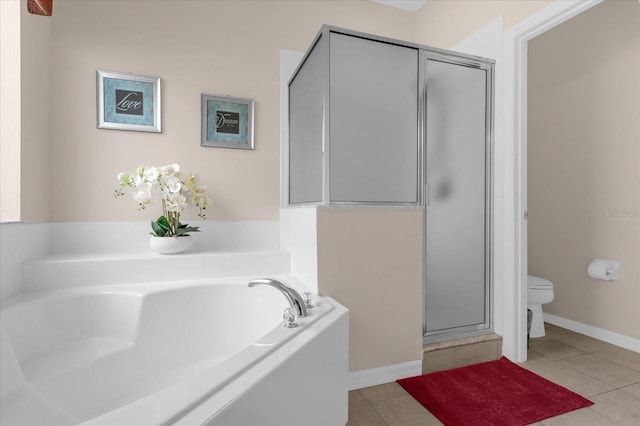 bathroom featuring tile patterned flooring, toilet, and plus walk in shower