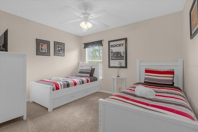 bedroom featuring light colored carpet and ceiling fan