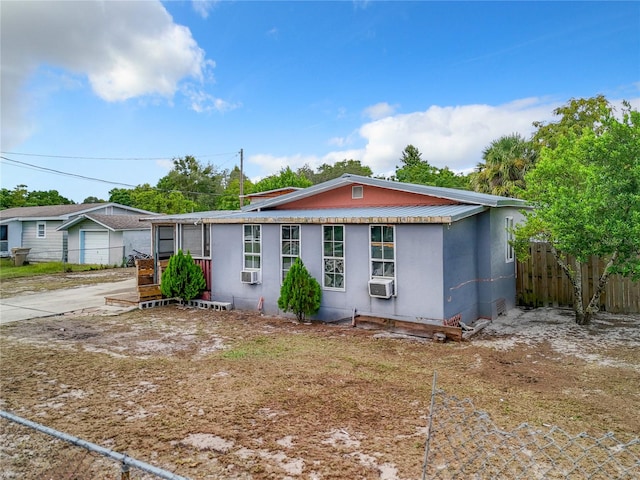 view of front of property featuring cooling unit