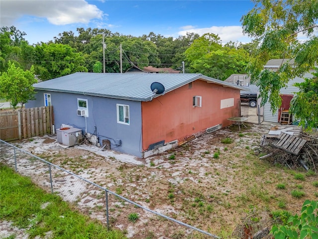 back of property with cooling unit