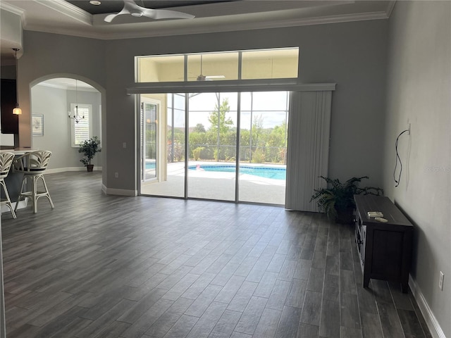 living room with ceiling fan, dark hardwood / wood-style floors, and ornamental molding