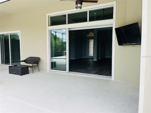 view of patio with ceiling fan