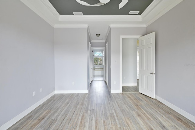 unfurnished room featuring light wood-type flooring and ornamental molding