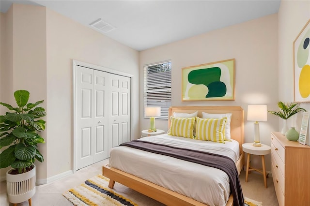 carpeted bedroom with a closet