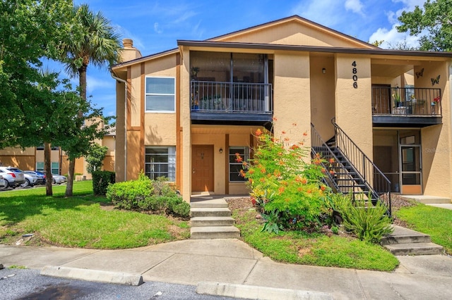 view of front of house with a front lawn