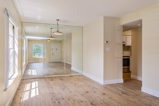 unfurnished room featuring light hardwood / wood-style flooring