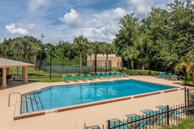 view of swimming pool with a patio area