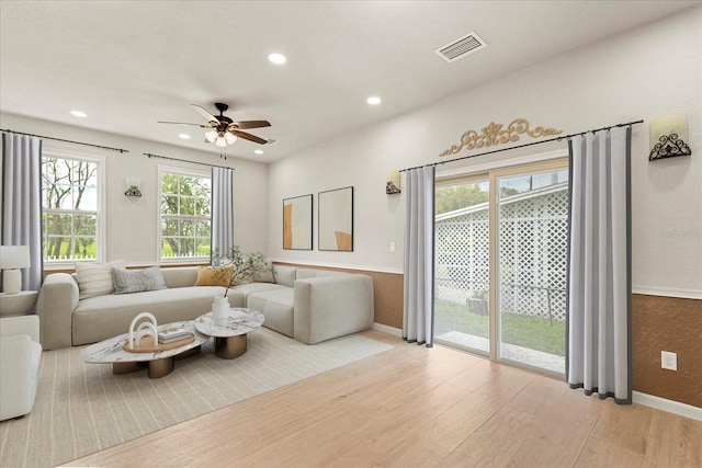 living room featuring recessed lighting, visible vents, ceiling fan, wood finished floors, and baseboards