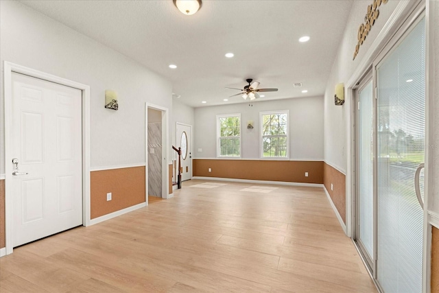 unfurnished room with recessed lighting, baseboards, ceiling fan, and light wood finished floors