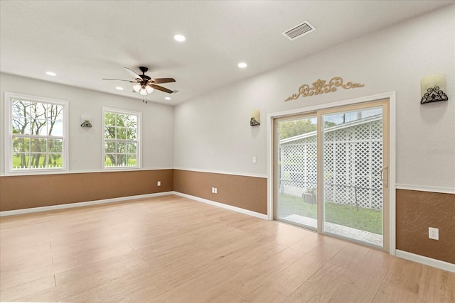 spare room featuring recessed lighting, visible vents, light wood-style flooring, ceiling fan, and baseboards