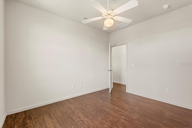 empty room with ceiling fan, baseboards, and wood finished floors