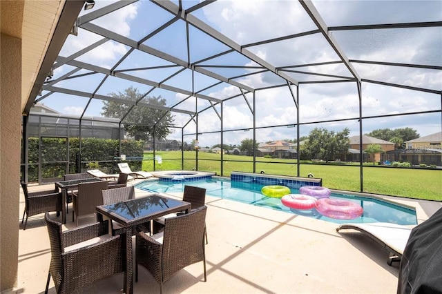 view of swimming pool featuring a patio area, an in ground hot tub, a yard, and a lanai