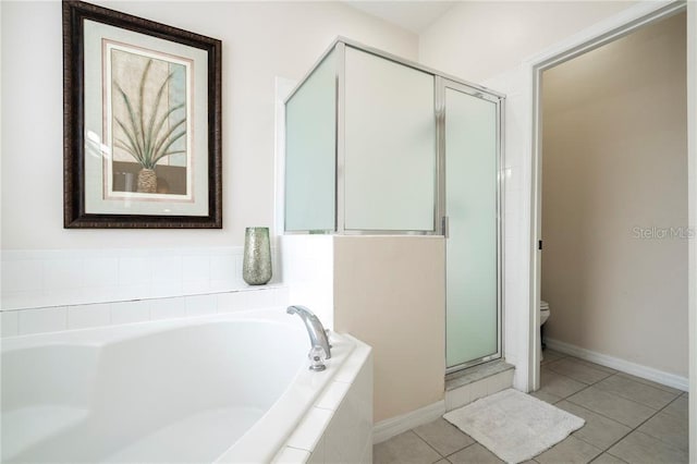 bathroom featuring independent shower and bath, toilet, and tile patterned floors