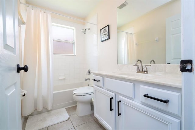 bathroom featuring shower / bath combination with curtain, vanity, tile patterned flooring, and toilet