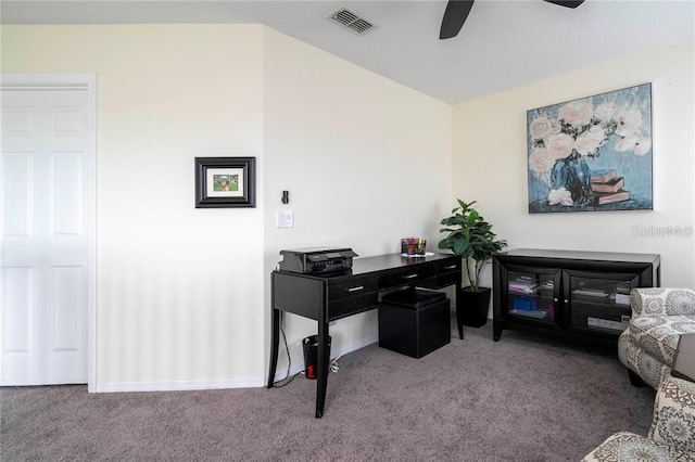 carpeted home office featuring ceiling fan, baseboards, and visible vents