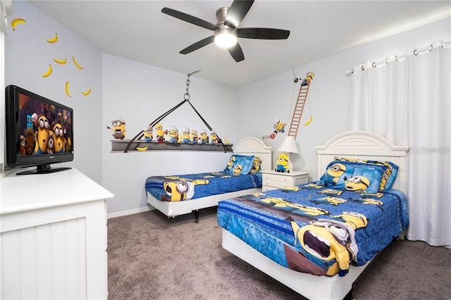 bedroom with a textured ceiling, carpet, and ceiling fan