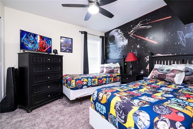 bedroom featuring a ceiling fan and carpet