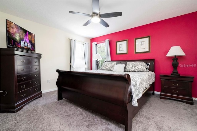 bedroom featuring carpet, baseboards, and ceiling fan