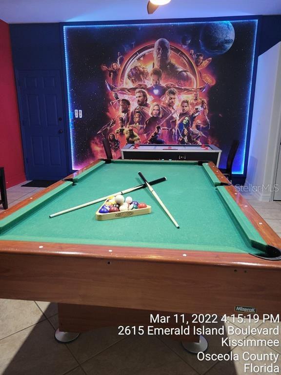 playroom featuring billiards and light tile patterned floors