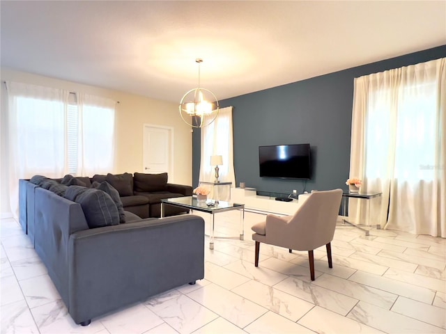 living room with a notable chandelier and marble finish floor