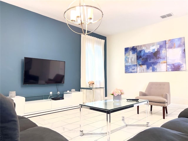 living room featuring tile patterned flooring, a notable chandelier, and visible vents