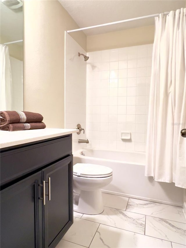 full bathroom featuring shower / bath combo with shower curtain, toilet, and vanity