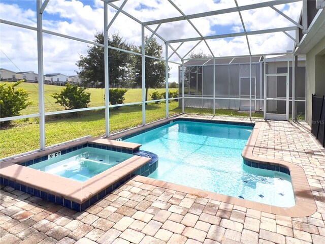 view of pool with glass enclosure and an in ground hot tub