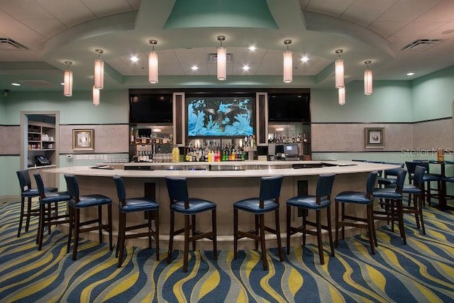 bar featuring visible vents and indoor wet bar