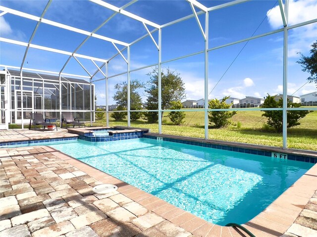 791 Pebble Beach Dr, Davenport, FL 33896 - view of swimming pool with a patio area, glass enclosure, and a pool with connected hot tub